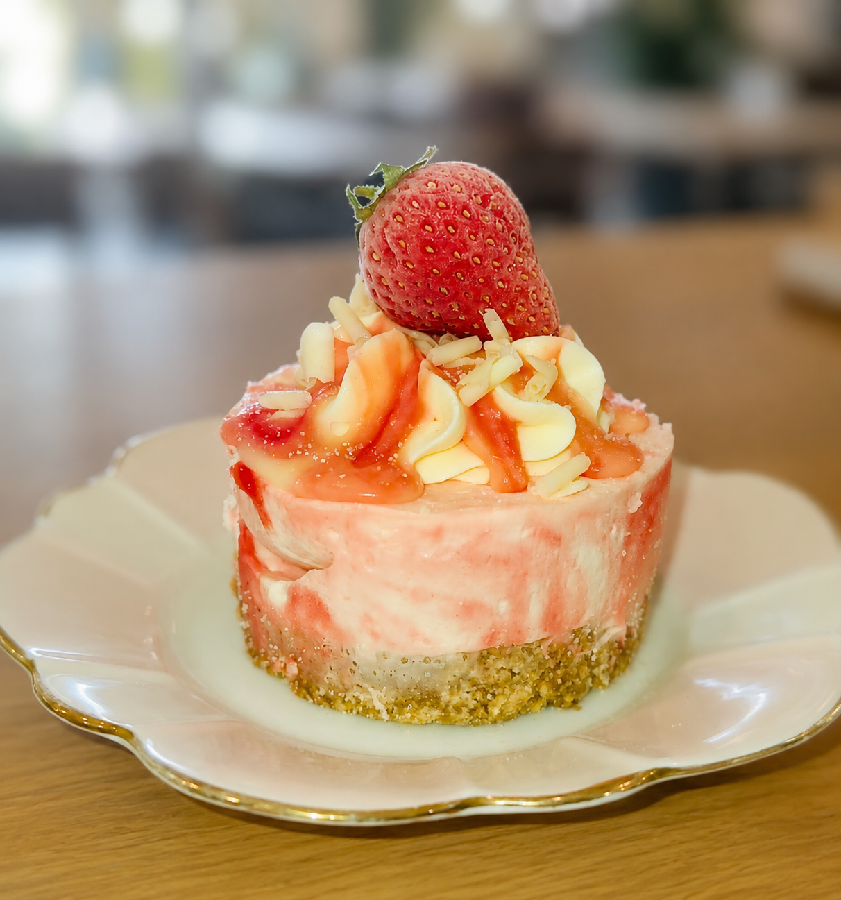 Strawberry cheesecake served on a plate at Oscars Coffee House